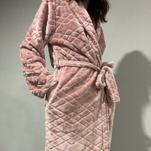 Pink fuzzy bath robe